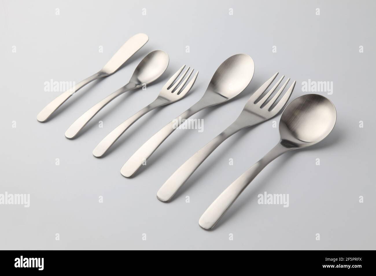 stainless steel cutlery sppons forks knife isolated on white background
