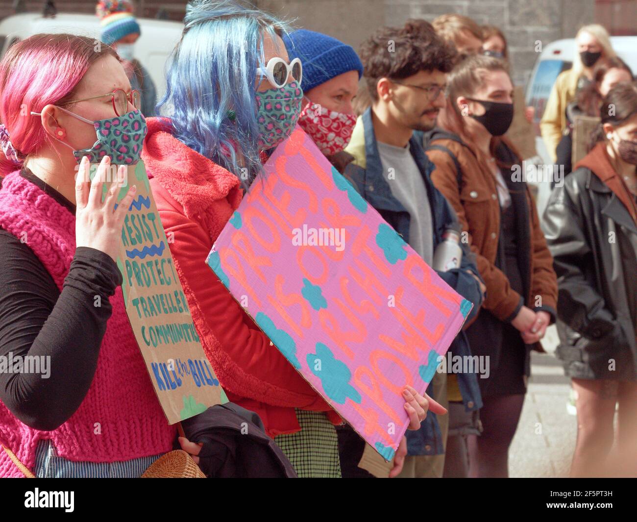 Falmouth, Cornwall, UK.  27 March, 2021. A Kill the bill demonstration and March involving several hundred protesters happens at The Moor square in Falmouth, After speakers finished, a march 1.5 miles through the center of town to Discovery Quay took place for further speeches. The protest in breach of Covid rules was policed at a distance by Devon and Cornwall officers. The proposed Police, crime and sentencing and courts bill could cause serious limitations to protesters deemed to be causing serious disruption. Falmouth. Cornwall, England, 27th March 2021, Credit: Robert Taylor/Alamy Live Ne Stock Photo