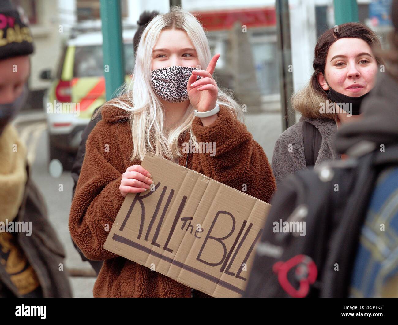 Falmouth, Cornwall, UK.  27 March, 2021. A Kill the bill demonstration and March involving several hundred protesters happens at The Moor square in Falmouth, After speakers finished, a march 1.5 miles through the center of town to Discovery Quay took place for further speeches. The protest in breach of Covid rules was policed at a distance by Devon and Cornwall officers. The proposed Police, crime and sentencing and courts bill could cause serious limitations to protesters deemed to be causing serious disruption. Falmouth. Cornwall, England, 27th March 2021, Credit: Robert Taylor/Alamy Live Ne Stock Photo