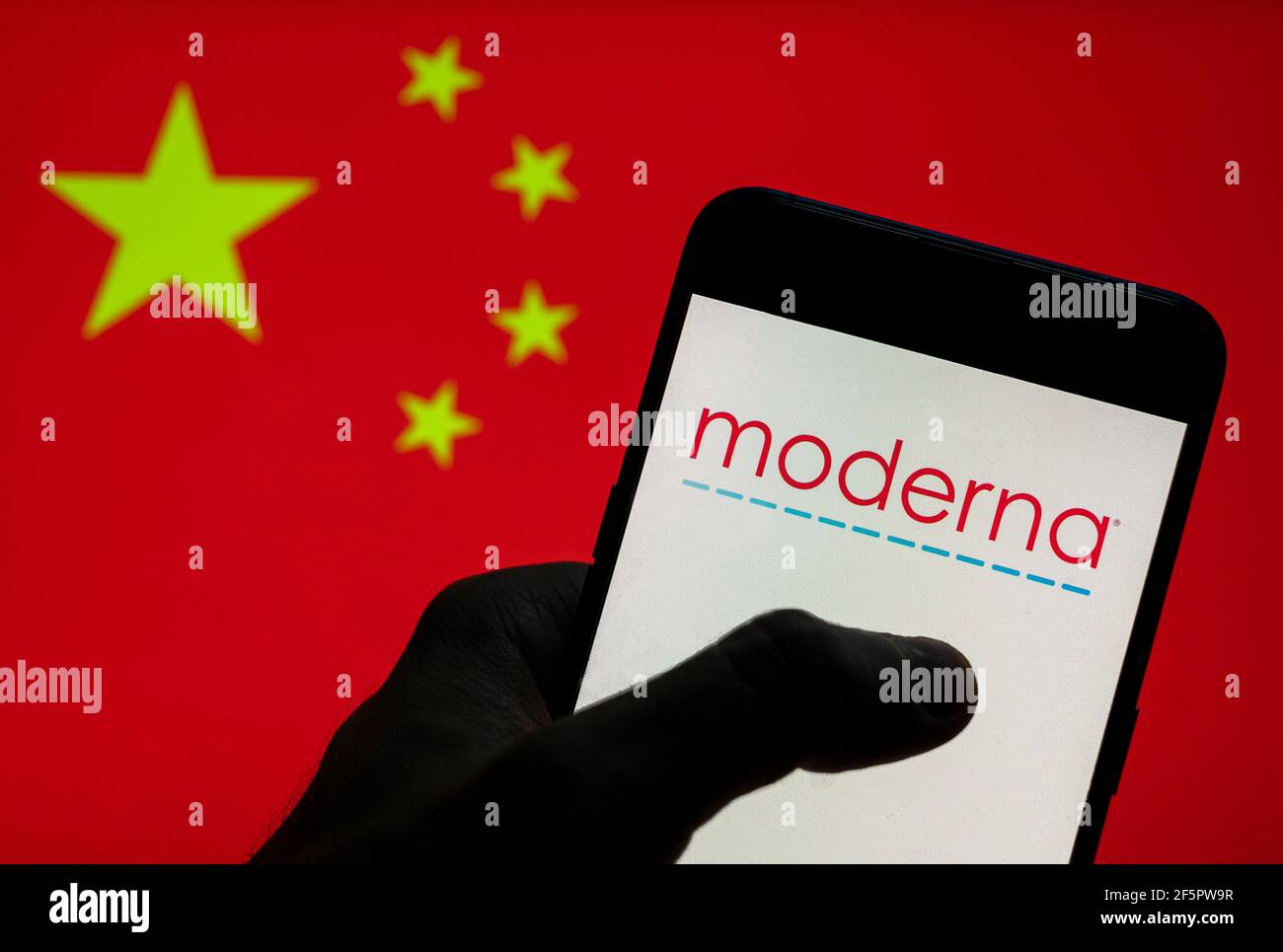 In this photo illustration, the American pharmaceutical and biotechnology company Moderna logo seen on an Android mobile device with People's Republic of China flag in the background. Stock Photo