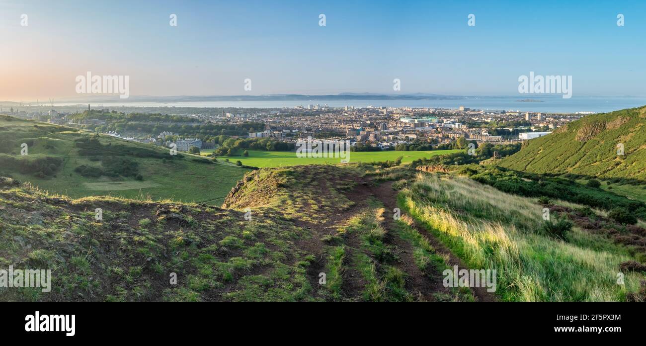 Panorama Of Edinburgh, Scotland, Including Holyrood Palace And Calton Hill, As Taken From Arthur's Seat On A Beautiful, Clear Summer Evening Stock Photo