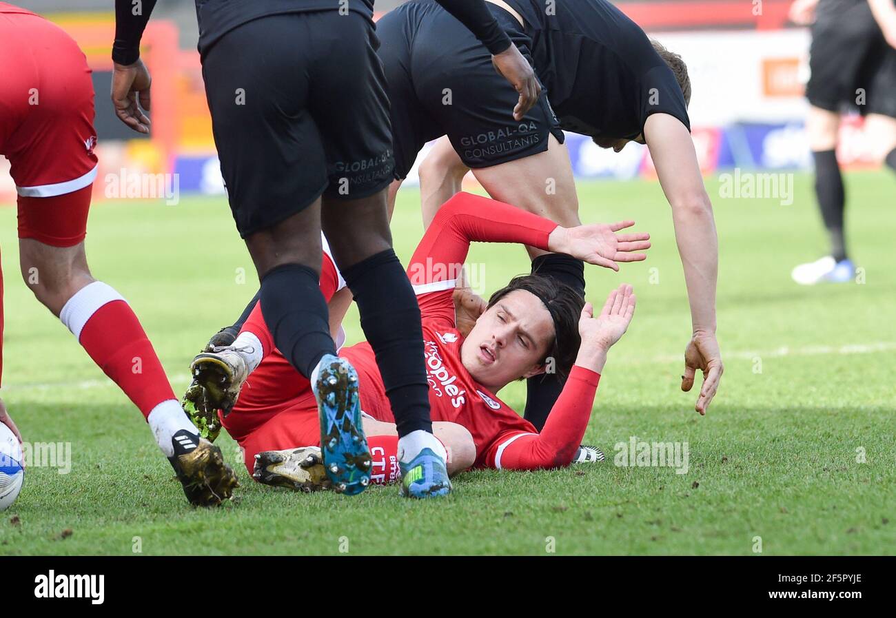 Tom Nichols of Crawley gets tangled up during the Sky Bet League Two match between Crawley Town and Port Vale at the People's Pension Stadium   , Crawley ,  UK - 27th March 2021 - Editorial use only. No merchandising. For Football images FA and Premier League restrictions apply inc. no internet/mobile usage without FAPL license - for details contact Football Dataco Stock Photo