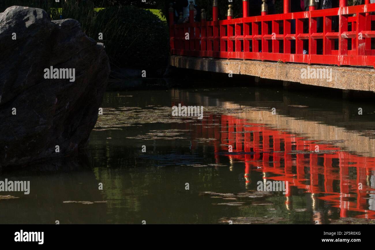 Red wooden bridge in the japanese garden Stock Photo