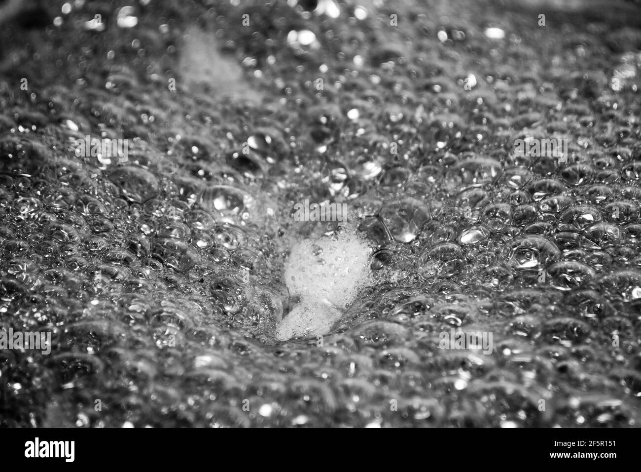 Colorless foam. Foam texture as background. Background and texture concept. Close up of bubbling colorless foam Stock Photo
