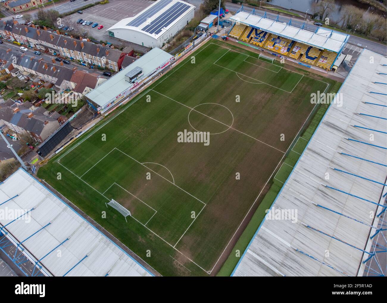 Mansfield Town England Football club One Call Stadium from the air drone photography looking down at MTFC league seating and pitch field no people Stock Photo