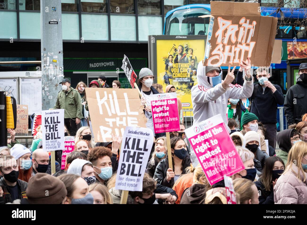 Manchester, UK. 27th Mar, 2021. Protesters stage a sit-in protest at Piccadilly bus terminal during a 'Kill The Bill' demonstration. People come out to the streets to protest against the new policing bill. The new legislation will give the police more powers to control protests. Credit: Andy Barton/Alamy Live News Stock Photo
