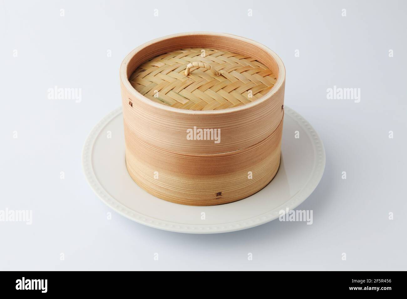xiaolong Chinese bamboo steaming basket isolated on white background