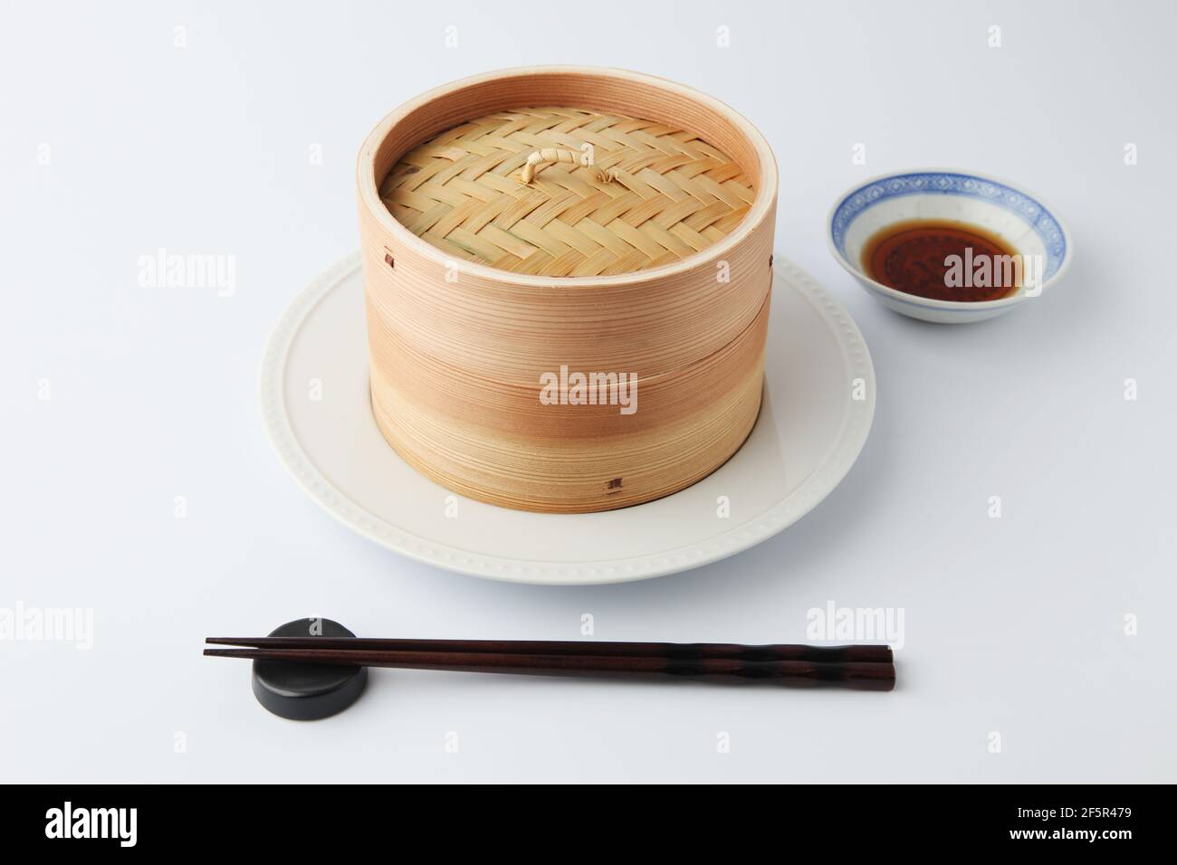 xiaolong Chinese bamboo steaming basket isolated on white background