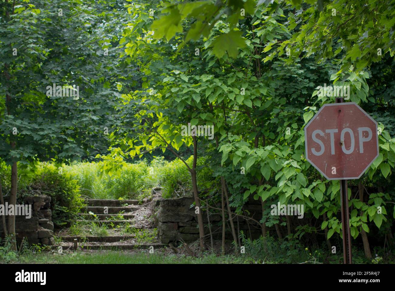 A stop sign in the abandoned Town of Centralia Pennsylvania where the fire and heat continue to burn below Stock Photo