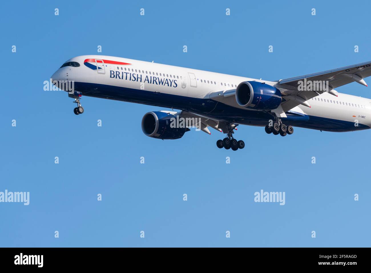 British Airways Airbus A350 jet airliner plane G-XWBC on finals to land at London Heathrow Airport, UK, in blue sky. BA, part of IAG. Flag carrier Stock Photo