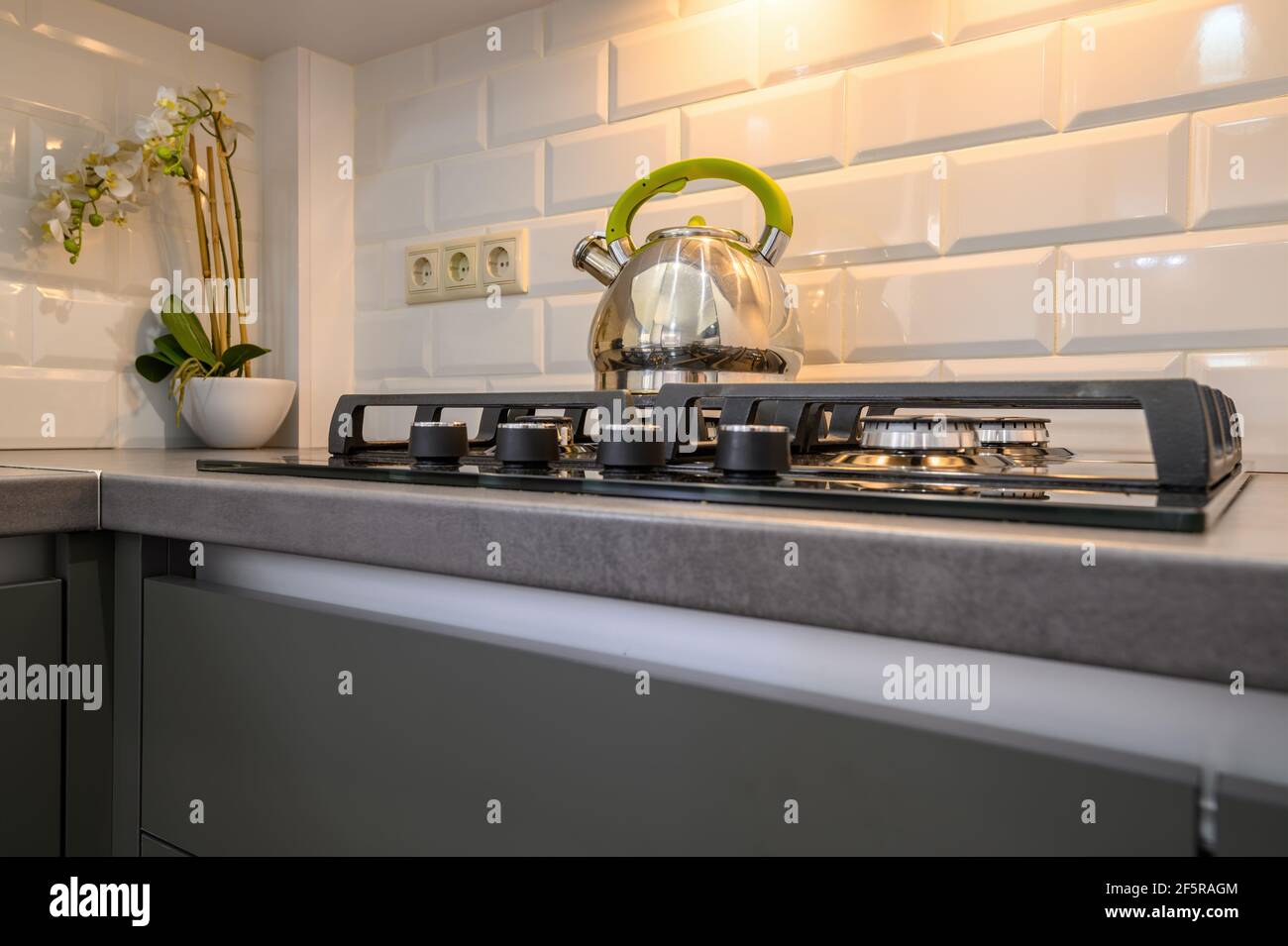 Modern dark grey small kitchen interior Stock Photo - Alamy