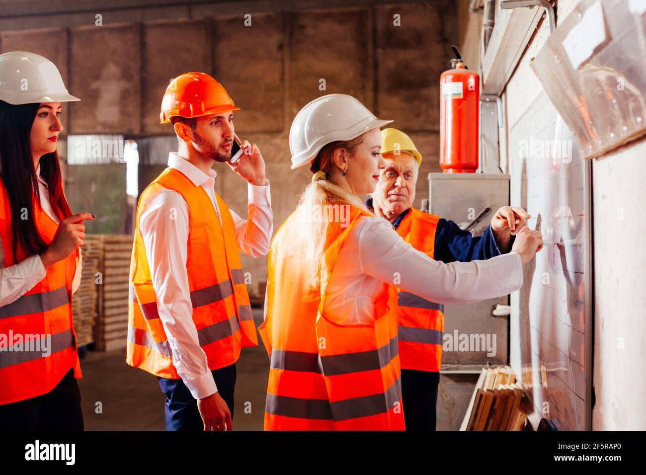 The young engineers are practicing at the factory Stock Photo - Alamy