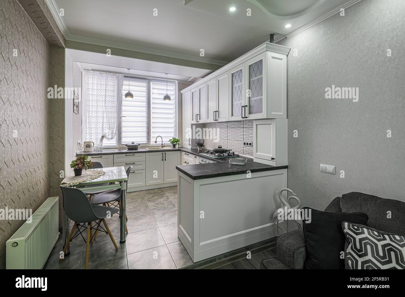 Modern white kitchen interior, front view Stock Photo - Alamy