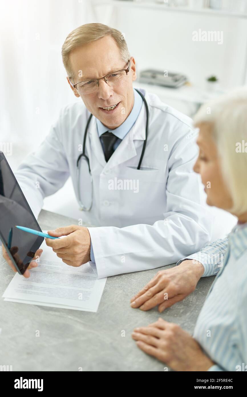 Female doctor talking patient using hi-res stock photography and images ...
