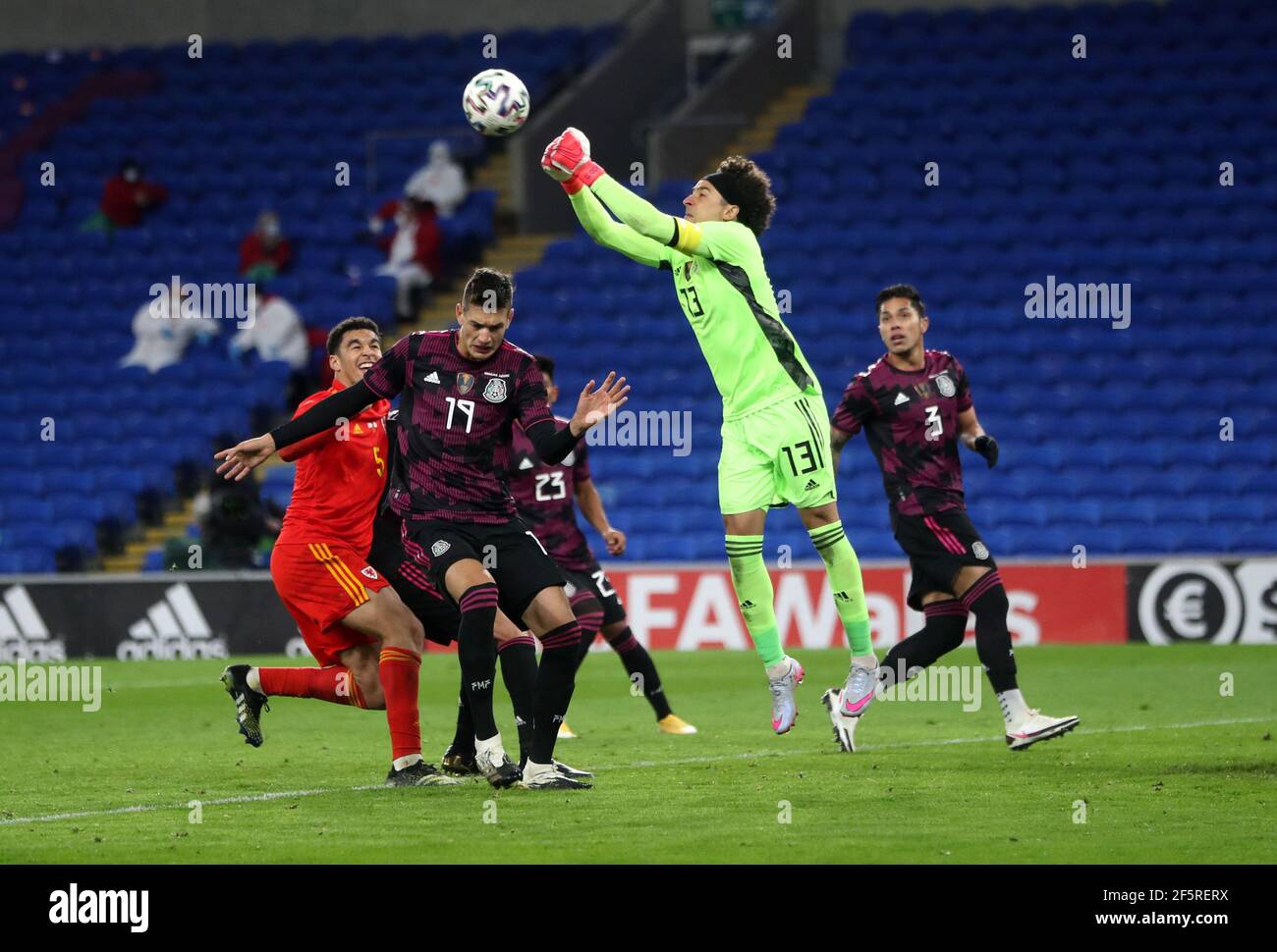 Mexico goalkeeper Guillermo Ochoa punches the ball clear during the international friendly at the Cardiff City Stadium, Cardiff. Picture date: Saturday March 27, 2021. Stock Photo