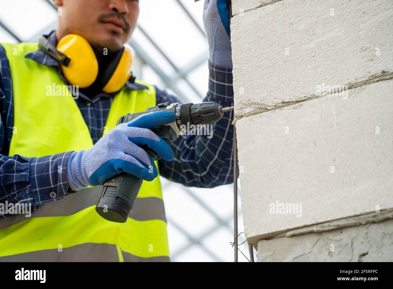 Worker drill drilling machine hires stock photography and images Alamy