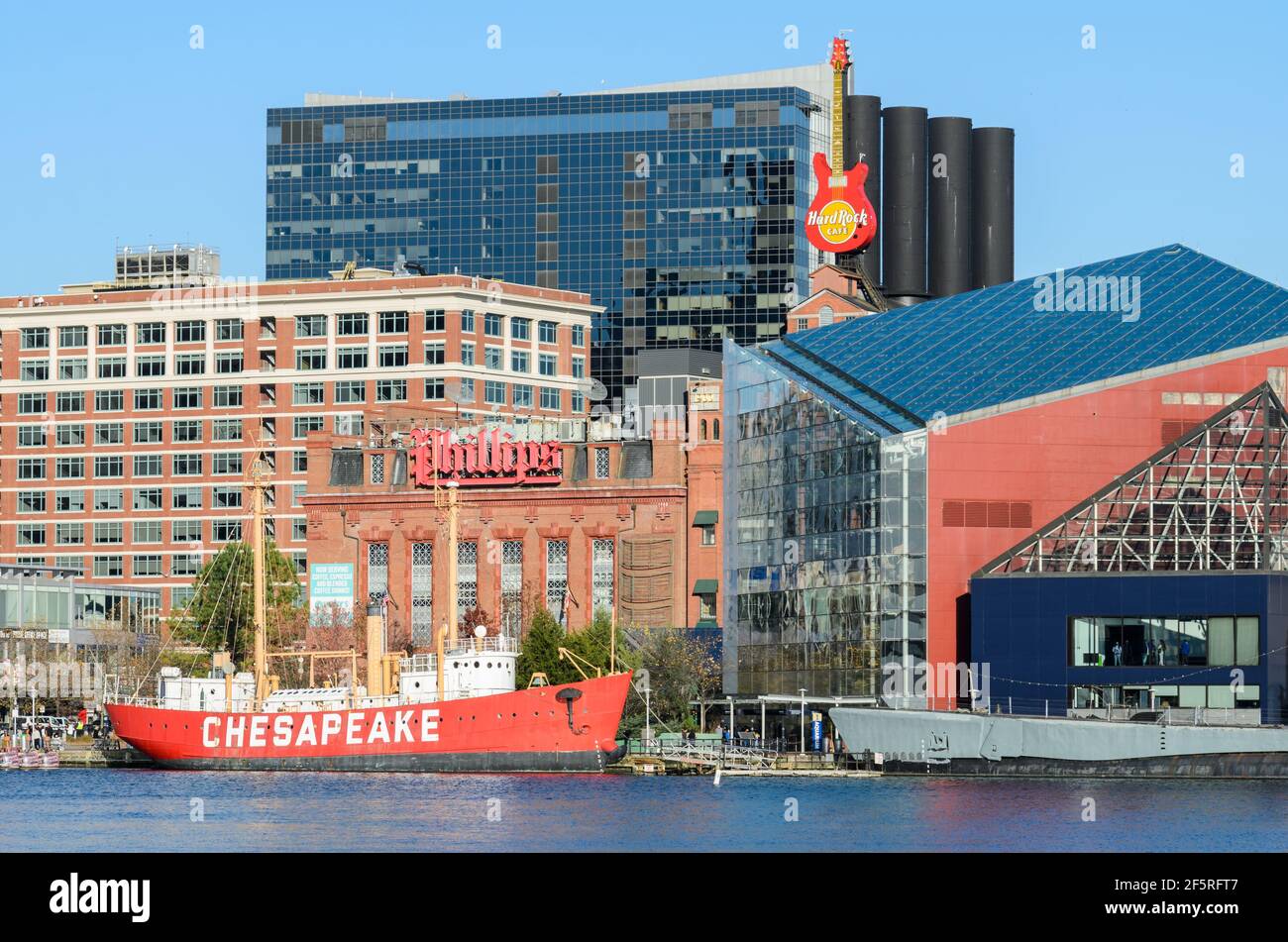 The Baltimore Skyline on a winter's day, with the National Aquarium, Chesapeake Light Ship, Phillips Sea Food and Hard Rock Cafe Stock Photo
