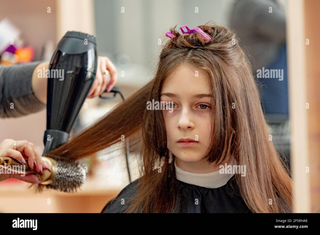 Happy Girl Getting her Hair Cut. A series of photos of a girl getting