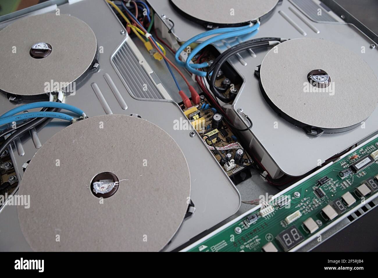 Disassembled induction plate without covering glass, induction cooker