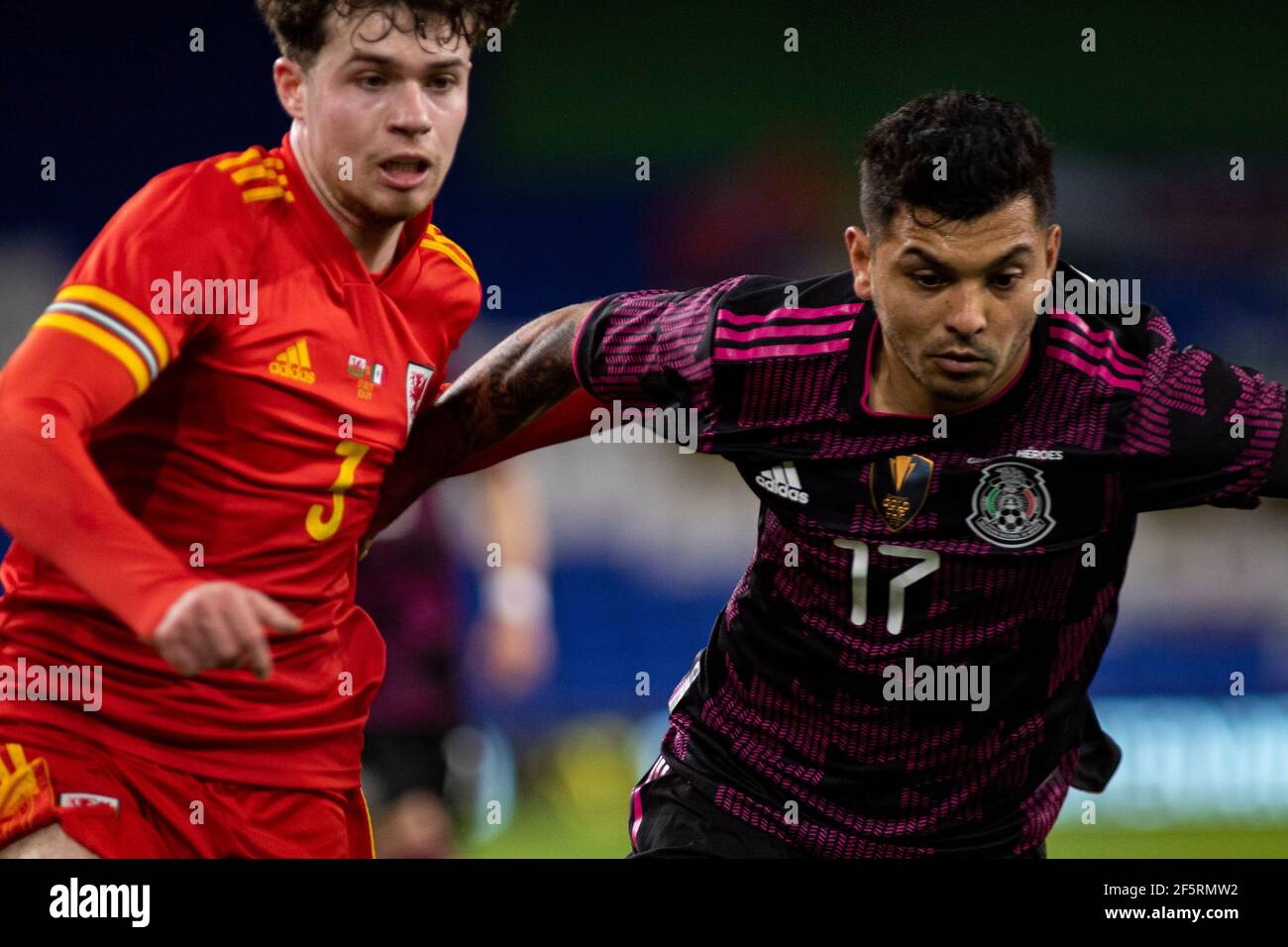 Cardiff, UK. 27th Mar, 2021. Jesús Manuel Corona of Mexico (R) in action against Neco Williams of Wales (L) Football international friendly match, Wales v Mexico, at the Cardiff city stadium in Cardiff, South Wales on Saturday 27th March 2021. Editorial use only. pic by Lewis Mitchell/Andrew Orchard sports photography/Alamy Live News Credit: Andrew Orchard sports photography/Alamy Live News Stock Photo