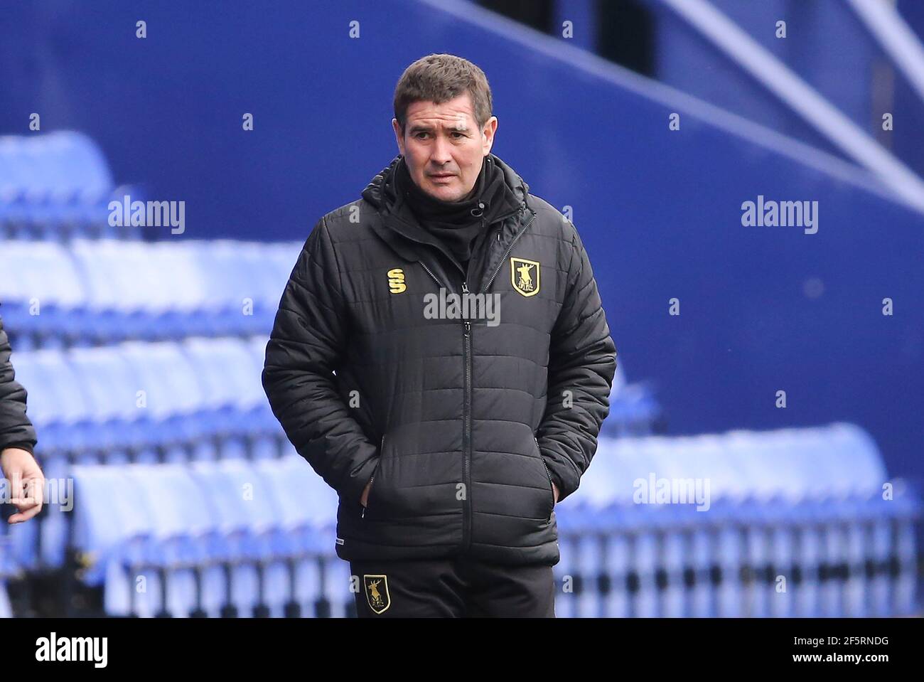 Birkenhead, UK. 27th Mar, 2021. Mansfield Town Manager Nigel Clough looks on. EFL Skybet Football league two match, Tranmere Rovers v Mansfield Town at Prenton Park, Birkenhead, Wirral on Saturday 27th March 2021. this image may only be used for Editorial purposes. Editorial use only, license required for commercial use. No use in betting, games or a single club/league/player publications.pic by Chris Stading/Andrew Orchard sports photography/Alamy Live News Credit: Andrew Orchard sports photography/Alamy Live News Stock Photo