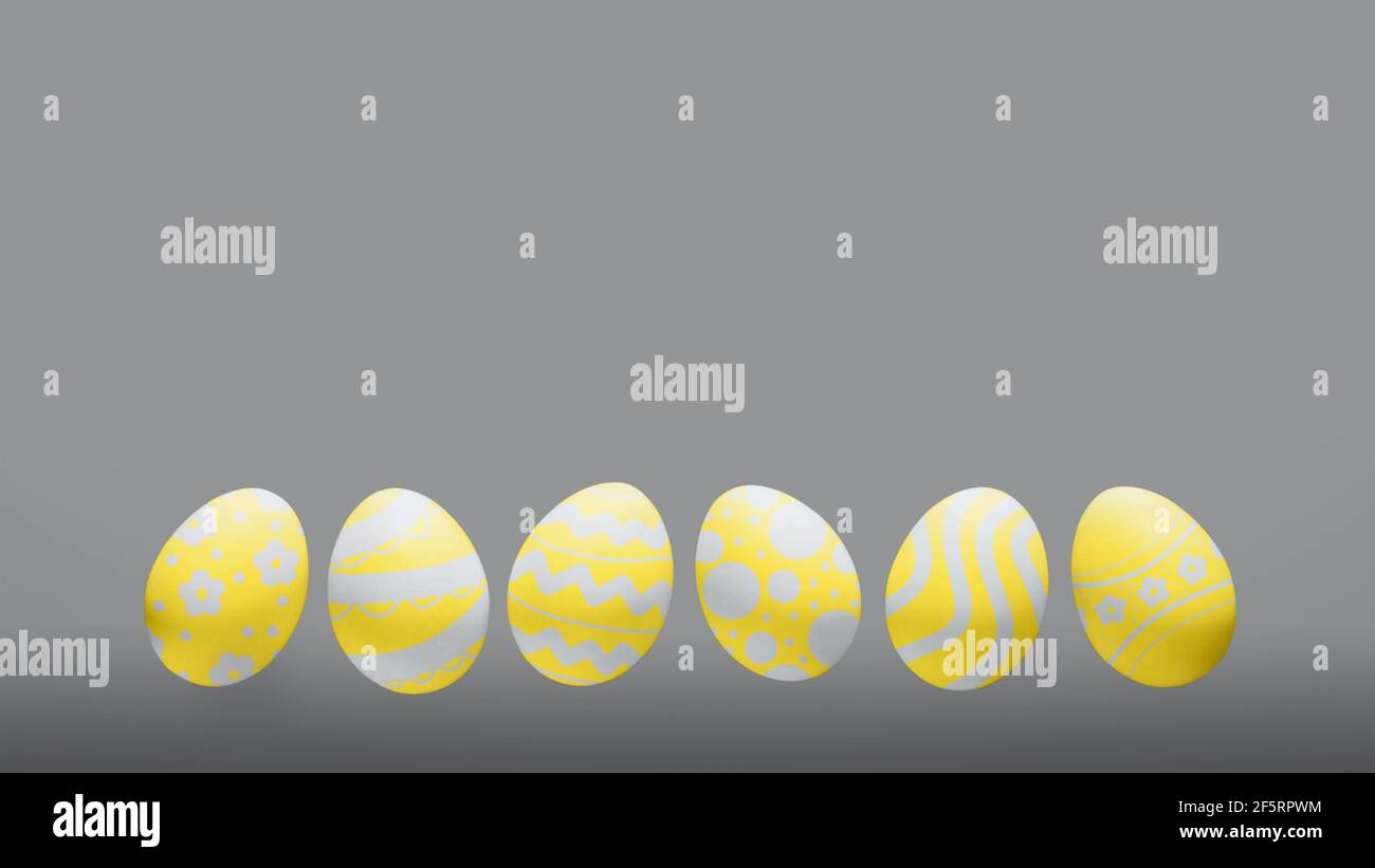 Yellow easter eggs in on gray background, copy space Stock Photo