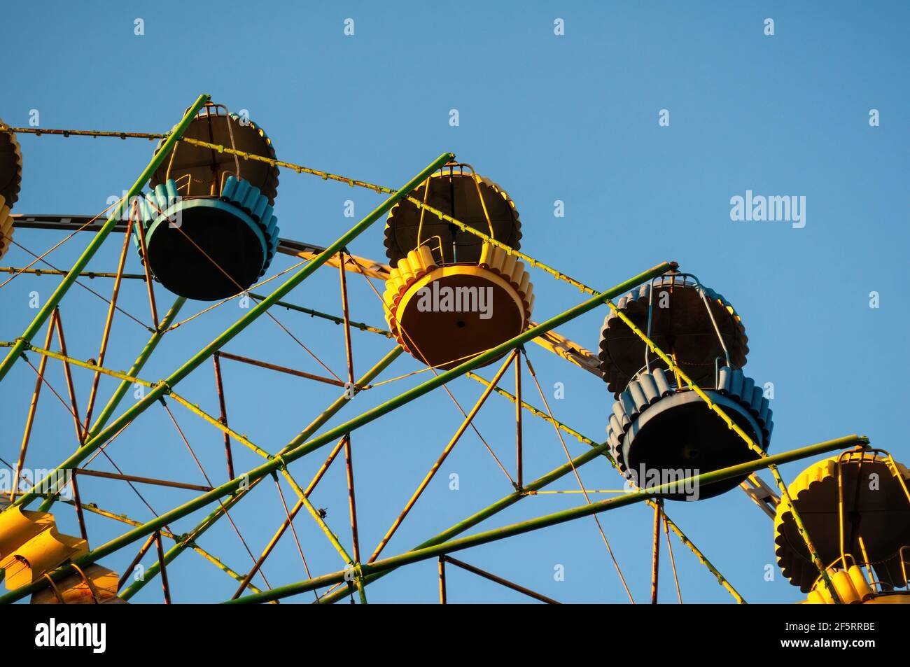 a colourful ferris wheel. front view. against the blue sky on a sunny day Stock Photo
