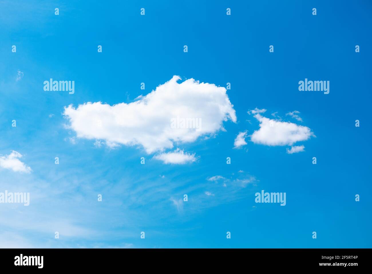 Pure blue sky with light white clouds Stock Photo - Alamy