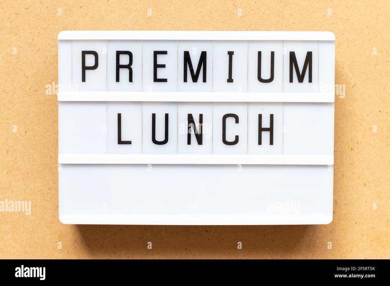 Lightbox with word premium lunch on wood background Stock Photo
