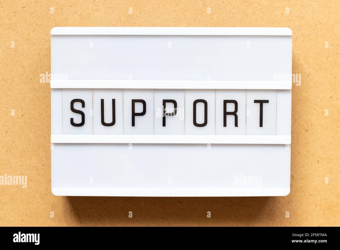 Lightbox with word support on wood background Stock Photo