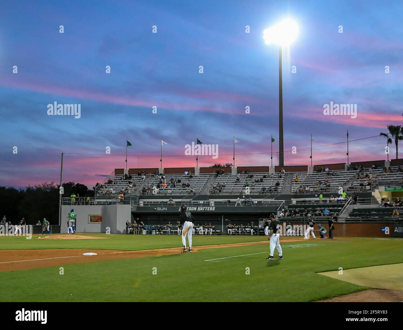 Deland, FL, USA. 27th Mar, 2021. Sunset at Melching Field during NCAA  baseball game between the Florida Gulf Coast Eagles and the Stetson Hatters  at Melching Field in Deland, FL Romeo T