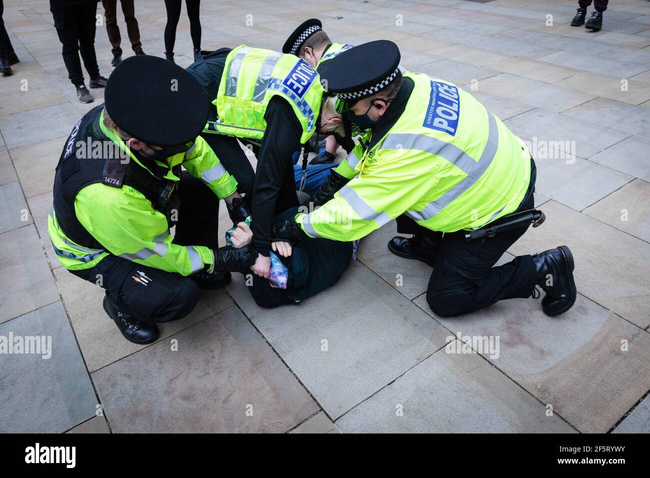 Manchester, UK. 27th Mar, 2021. A protester is being detained by police during the demonstration. People come out to the streets to protest against the new policing bill in a 'Kill The Bill demonstration'. The new legislation will give the police more powers to control protests. Credit: SOPA Images Limited/Alamy Live News Stock Photo