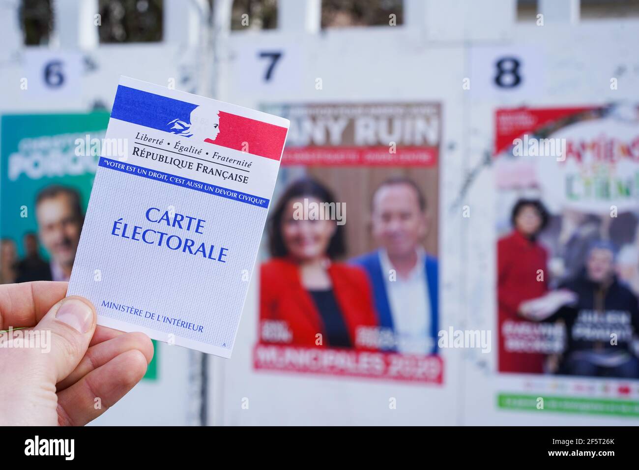 AMIENS, FRANCE - MARCH 15, 2020 : electoral posters for french local elections and voter card. Stock Photo