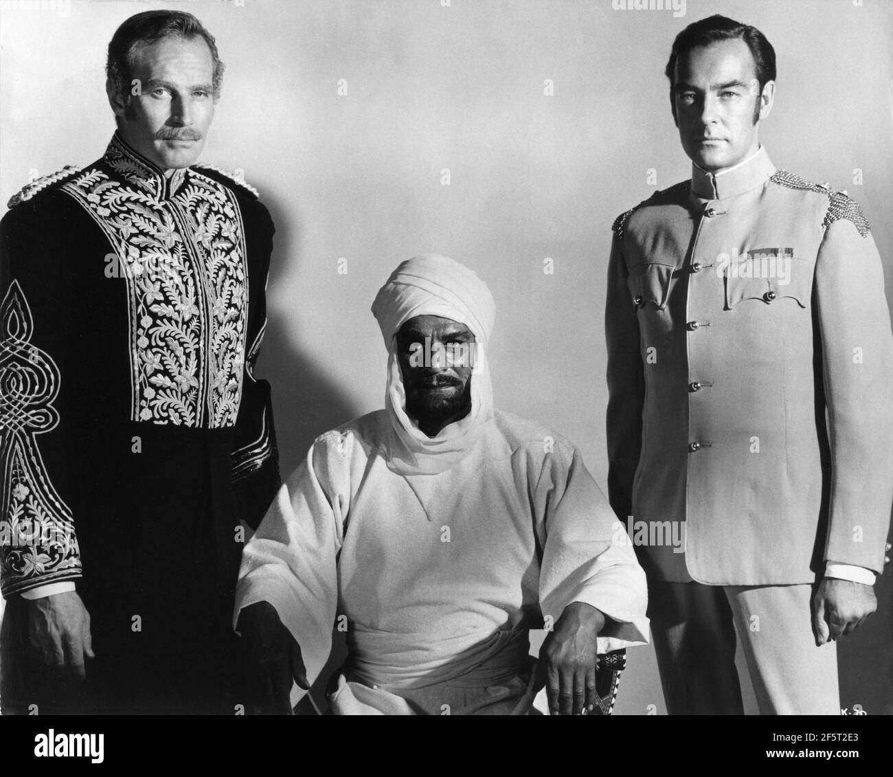 CHARLTON HESTON as General Charles ''Chinese'' Gordon LAURENCE OLIVIER as The Mahdi and RICHARD JOHNSON as Colonel J.D.H. Stewart Publicity Portrait for KHARTOUM 1966 director BASIL DEARDEN writer Robert Ardrey Julian Blaustein Productions Ltd. / United Artists Stock Photo