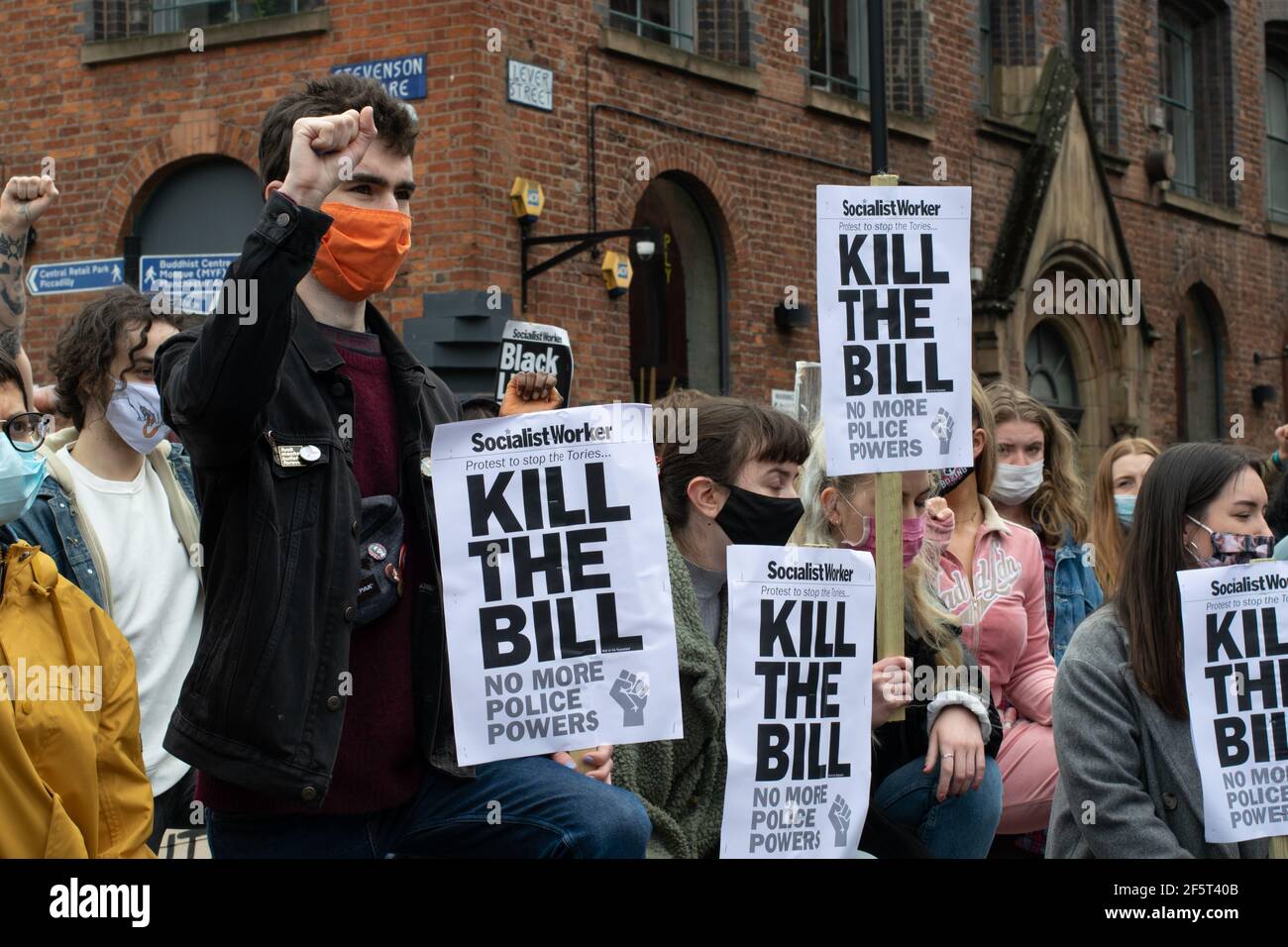 Kill the Bill protest, Norther Quarter, Manchester, UK  during the national lockdown in England. Protesters taking the knee for George Floyd silence. Stock Photo