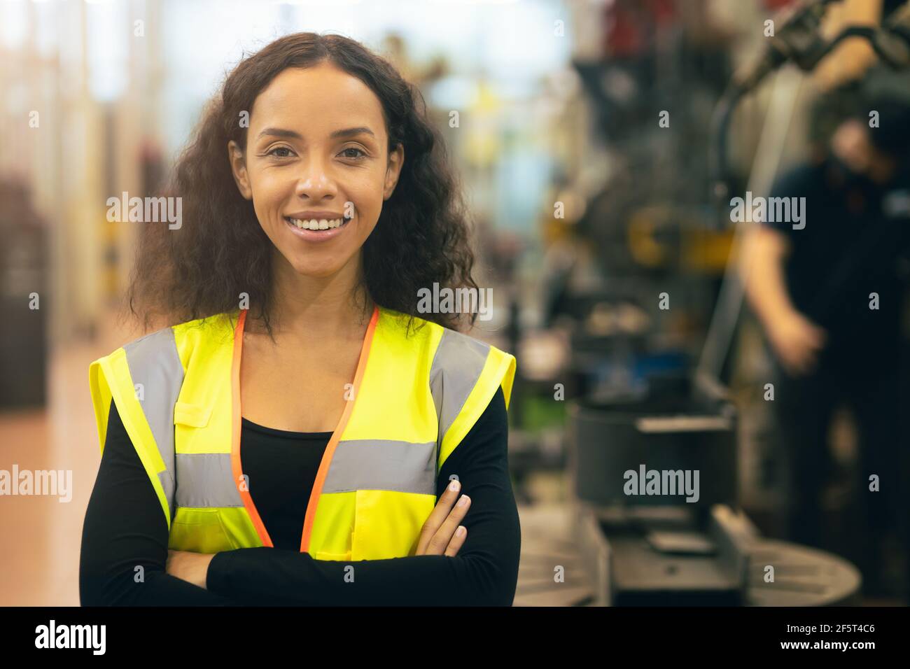 African American woman happy worker engineering working smile labor in heavy industry factory with good welfare concept. Stock Photo