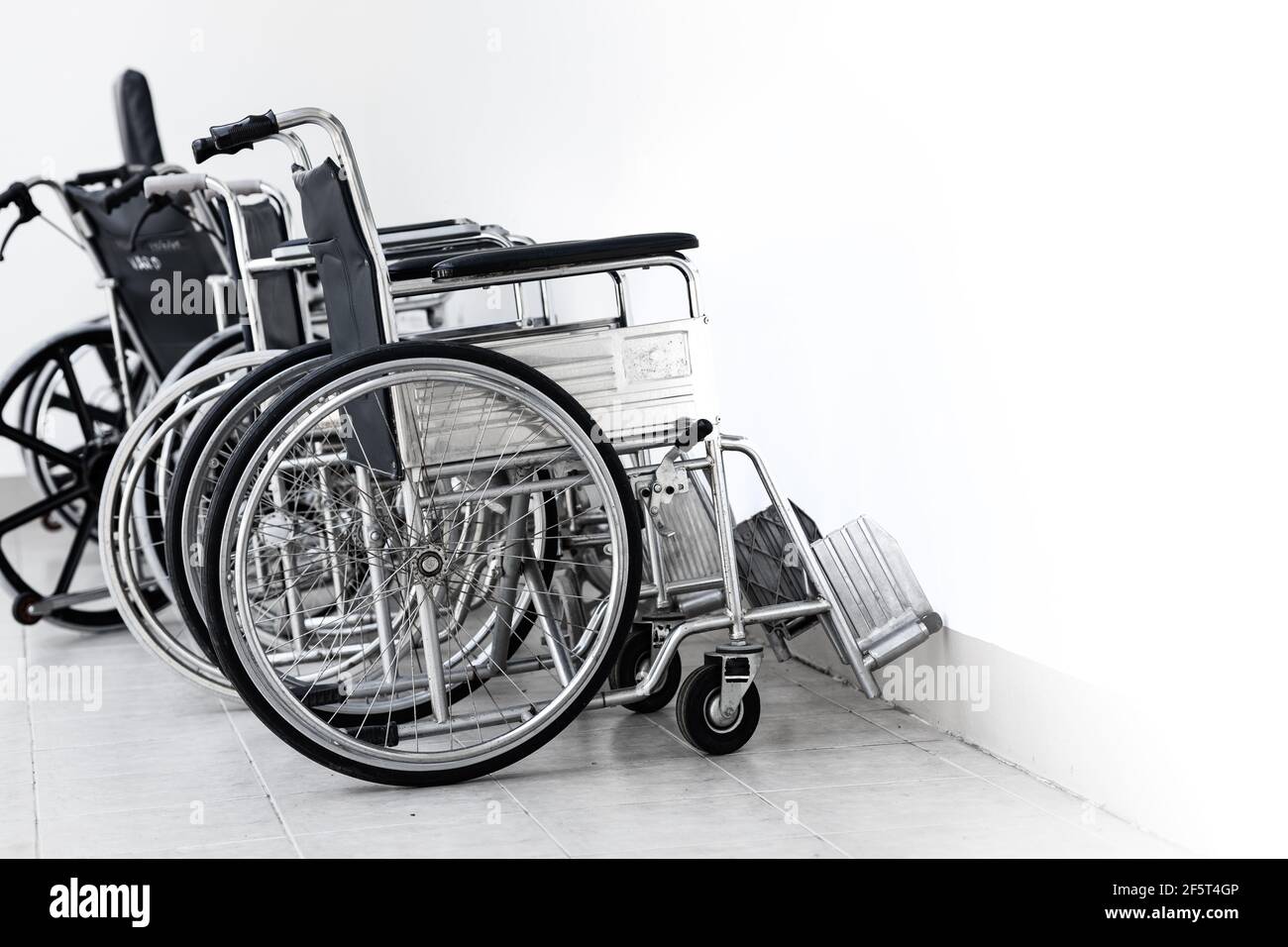 Wheelchair, a chair with wheels for disability people and hospital illness injury patient care. Stock Photo