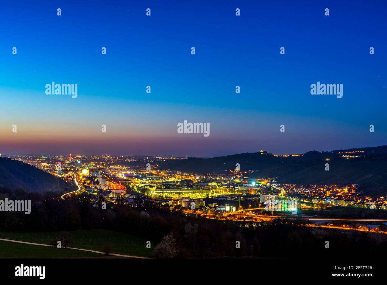 Germany, Magical sunset sky above houses, roofs and buildings near ...