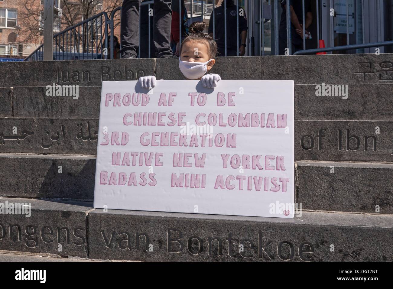 NEW YORK, NY - MARCH 27: Mia Gomez, age 4, holds a sign that reads proud  AF to be Chinese Colombian 3RD generation native New Yorker badass mini  activist at a National