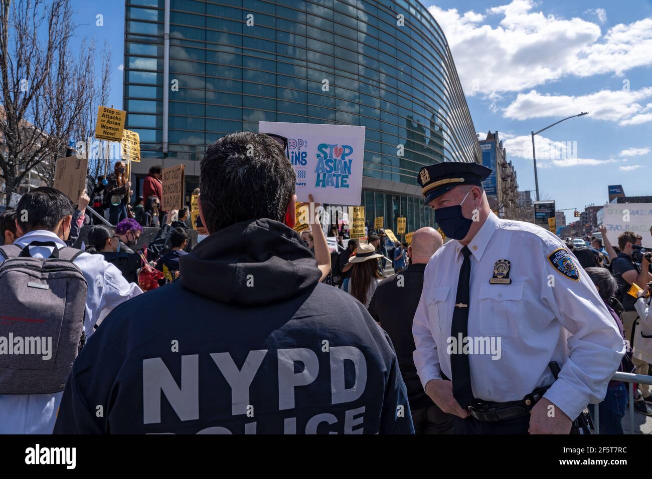 NEW YORK, NY - MARCH 27: New York Police Department (NYPD) Officers seen at a National Day of Action rally at the Flushing neighborhood on March 27, 2021 in the Queens borough of New York City.  Rallies and a show of support for Asian Americans sprang up Saturday across country as members and supporters of the Asian-American community take part in a National Day of Action. Credit: Ron Adar/Alamy Live News Stock Photo