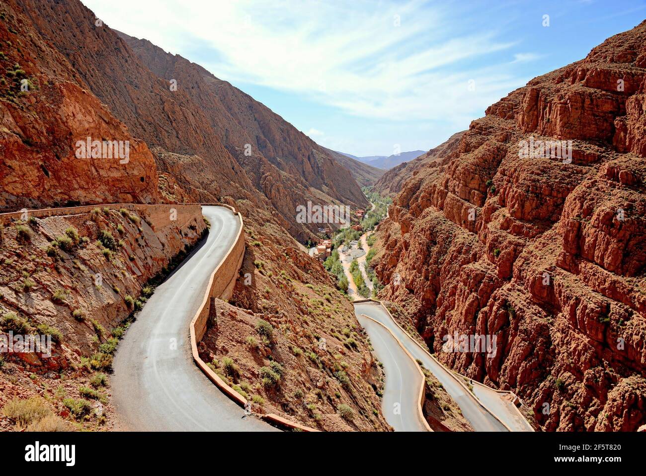 Located in the central Atlas massif, the Dades gorges reveal a breathtaking landscape: dizzying walls with ocher, red hues, green vegetation, villages Stock Photo