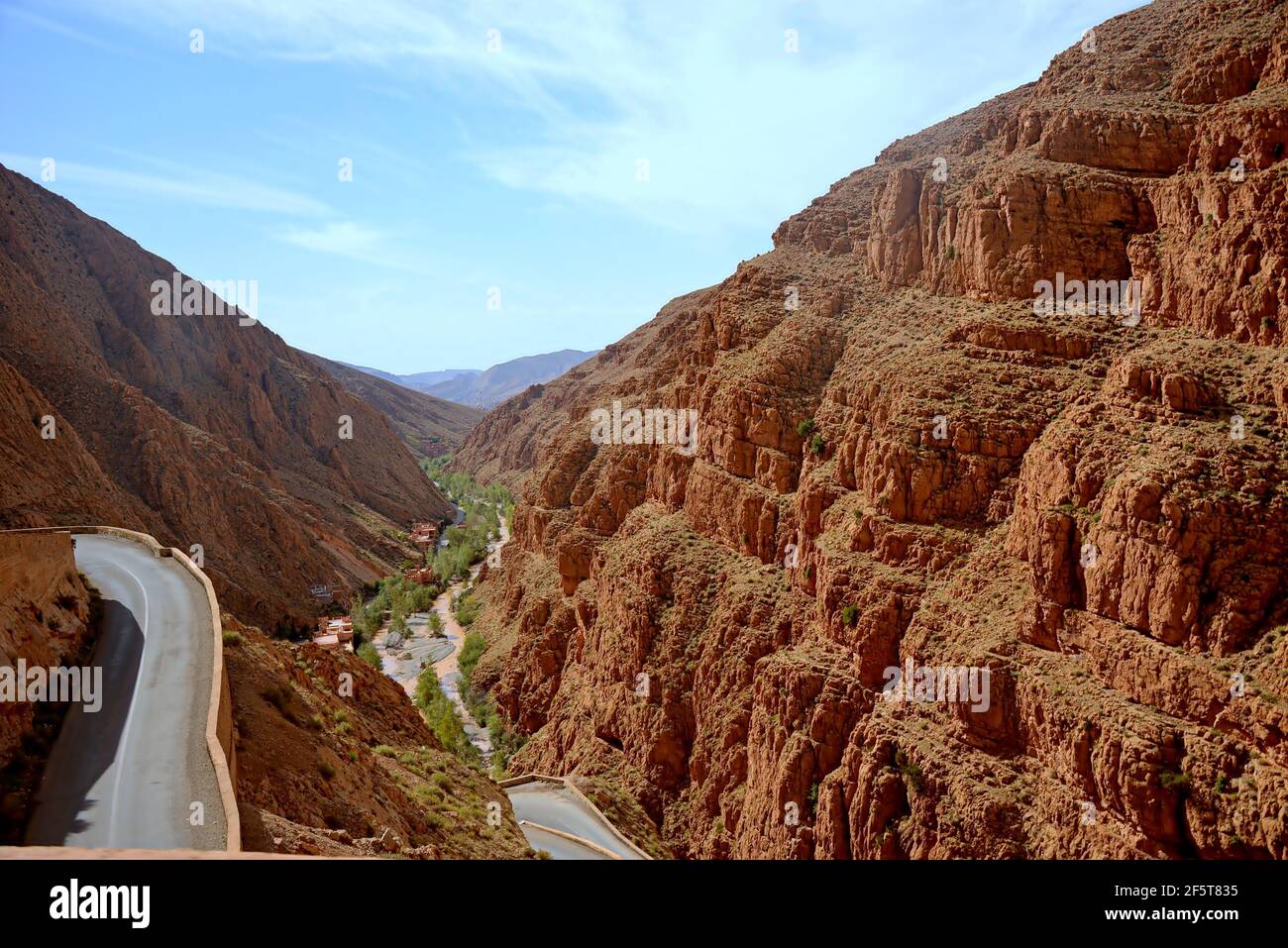 Located in the central Atlas massif, the Dades gorges reveal a breathtaking landscape: dizzying walls with ocher, red hues, green vegetation, villages Stock Photo