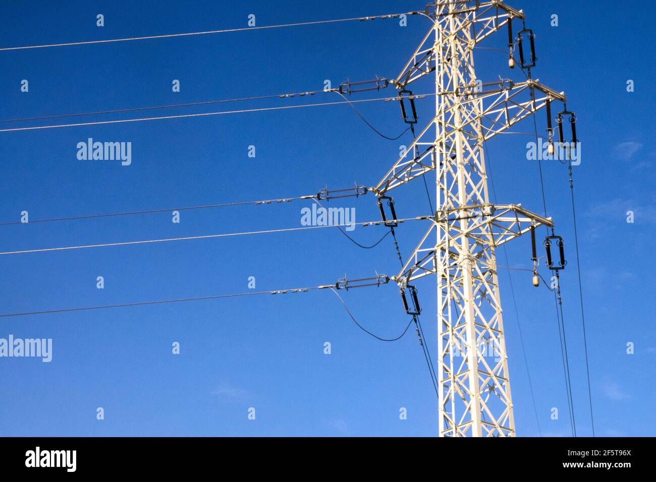 Frozen electric pylon, hoarfrost icing wires in winter Stock Photo