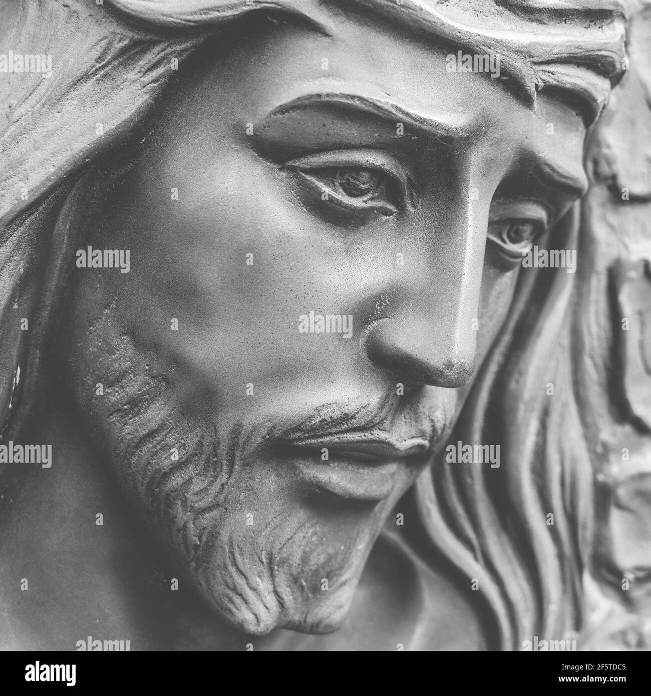 Statue of the face of jesus with a crown of thorns. Close-up. Ideal for concepts or events like Easter. Stock Photo