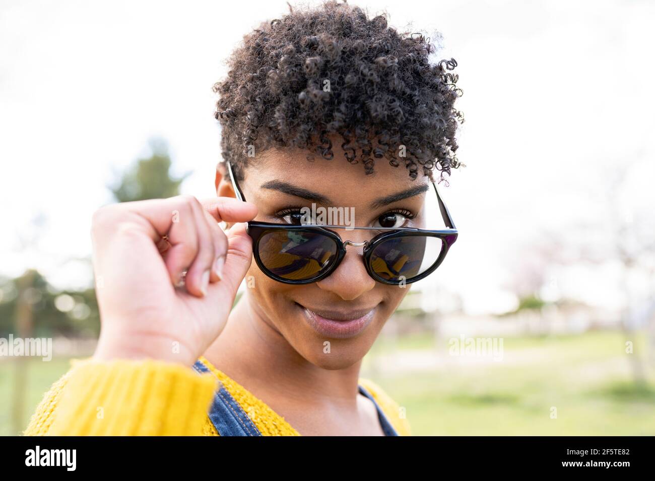 Charming woman smiling touching hi-res stock photography and images - Alamy