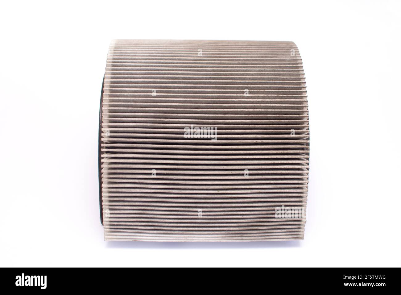 Dirty car air filter close-up. Isolated on a white background Stock Photo