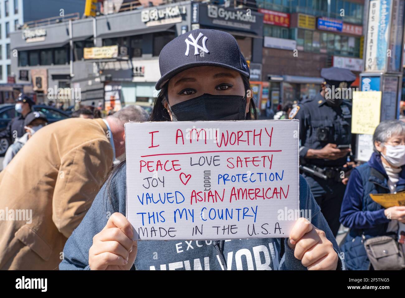 New York, United States. 27th Mar, 2021. A woman holds a placard during the National Day of Action rally at the Flushing neighbourhood.Rallies and a show of support for Asian Americans sprang up Saturday across country as members and supporters of the Asian-American community take part in a National Day of Action. Credit: SOPA Images Limited/Alamy Live News Stock Photo