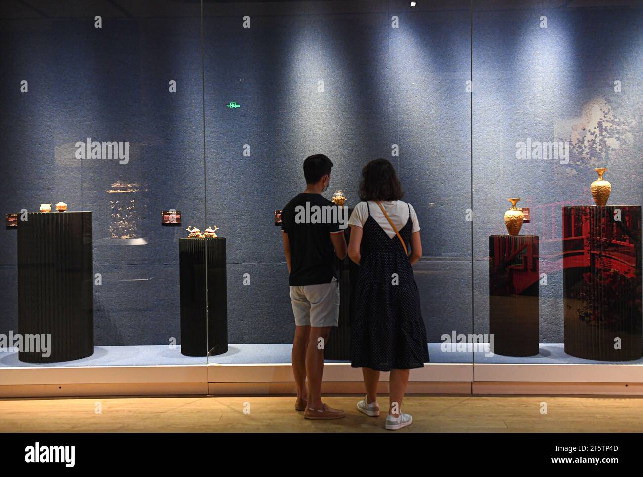 Haikou, China's Hainan Province. 28th Mar, 2021. People visit an art ...