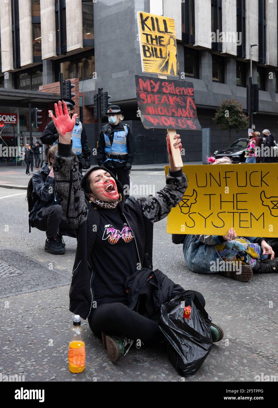 Manchester, UK. 27th March 2021. Protesters stage a sit-in protest at Portland street Manchester during a 'Kill The Bill' demonstration. The government's new legislation will give the police more powers to control protests. Picture: Gary Roberts Stock Photo