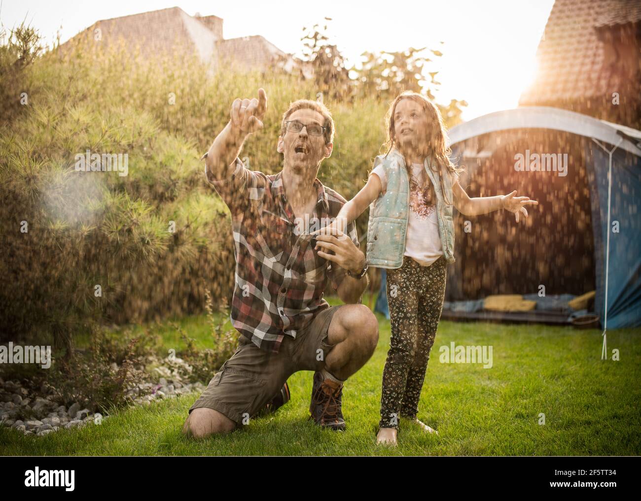 Cheerful family realxing on a summer camp Stock Photo